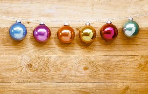 String of colourful christmas baubles Stock Photos