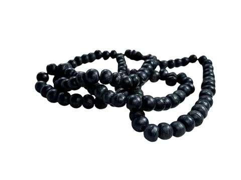 String of dark wooden prayer beads, isolated on a white background. Perfect.. Stock Photos