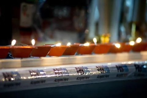 String of electric diyas placed on a store with paytm accepted here tape show Stock Photos