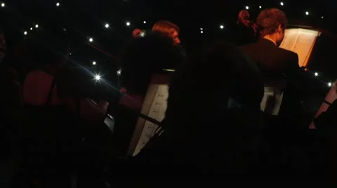String Family of An Orchestra Is Sitting Break Before Performing The Greatest Video stock 60228159