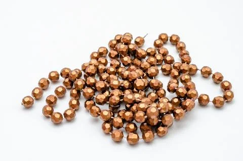 String of gold beads for the neck on a white background Stock Photos