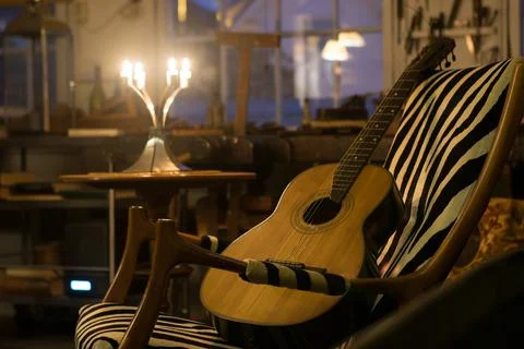 String guitar on an armchair Stock Photos