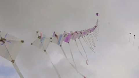 A string of kites floating in the wind Stock Footage 199744892