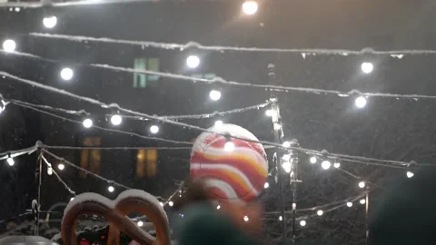 String lights above festival raised hand swinging through air in Stock Footage 236447652