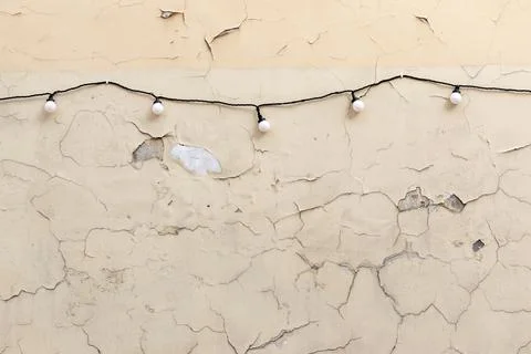 String lights and surface material texture of weathered peeling paint on wall Stock Photos