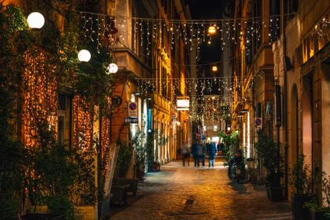 String lights on Via Belsiana at night, in Rome, Italy Foto stock