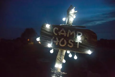 String lights on camp sign Stock Photos