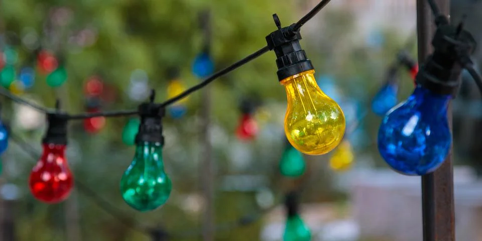 String lights with color lightbulbs Stock Photos