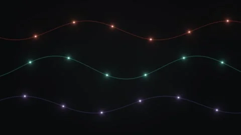 String lights create colorful patterns against a dark Stock Footage 339578855