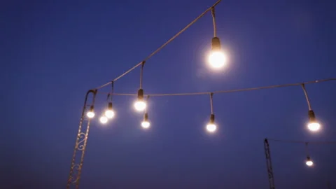 A string of lights hanging from a building Stock Footage 246340308