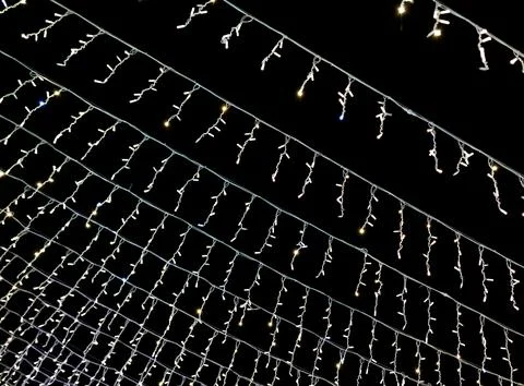 A string of lights is hanging from the ceiling Stock Photos
