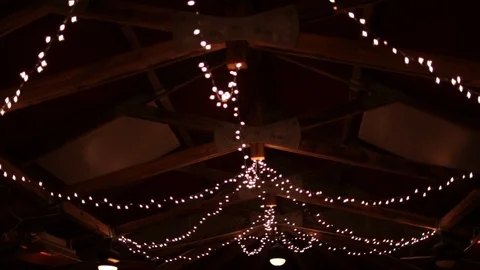 String lights hanging on farm ceiling night slight parallax Stock Footage 96550721