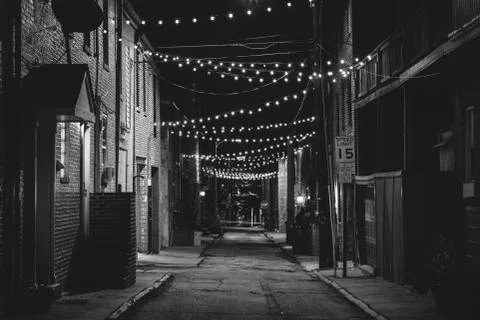 String lights over Chapel Street at night in Butchers Hill, Baltimore, Maryla Stock Photos