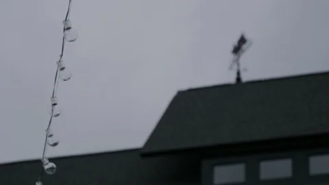 String lights rack focus to weather vane Stock Footage 115732064