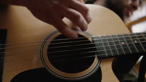 String music concept. Close up shot of musician hands playing guitar, performing Stock Footage 186996484