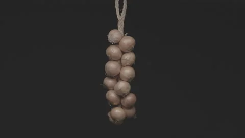 String of onions hanging Video stock 163950961