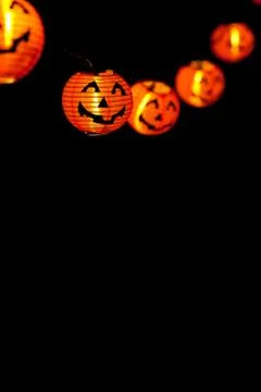 String of orange jack-o-lanterns Stock Photos