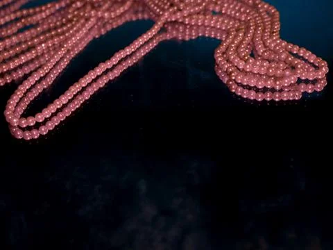 String of pearls presented with text space black glass frame. Fotos de archivo