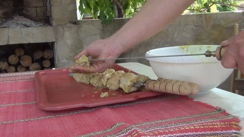 String pieces of meat on a skewer for subsequent frying on the barbecue grill Stock-Footage 116050973