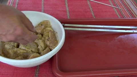 String pieces of meat on a skewer for subsequent frying on the barbecue grill Stock-Footage 116051095