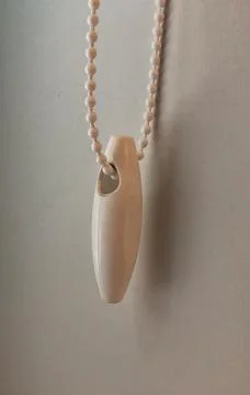 A string for pulling a blind open and closed beside a drawn shutter Stock Photos