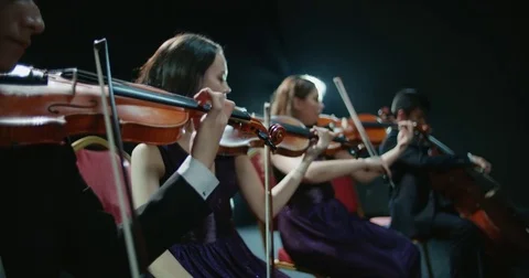 String quartet performs on stage, close-up of violin in work Stock Footage 84361483