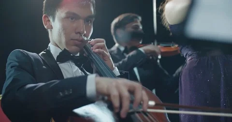 String quartet performs on stage, close-up Asian cellist playing classical music 動画素材 84361824