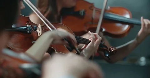 String quartet performs on stage, close-up of violin in work 動画素材 84362493