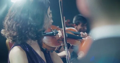 String quartet performs on stage, close-up of violin in work Vídeos de archivo 84363161
