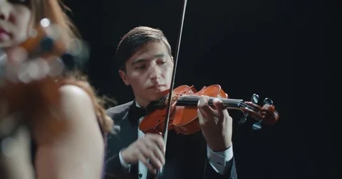 String quartet performs on stage, close-up of violin in work 動画素材 85045070