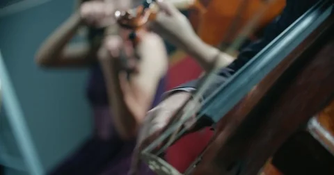 String quartet performs on stage, close-up of a cellist playing 動画素材 85045302