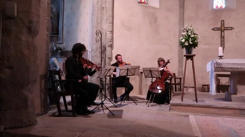 String quartet playing in church during wedding ceremony Stock Footage 93154533