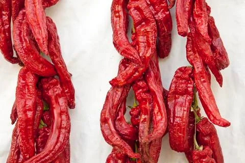 A string of red peppers Stock Photos