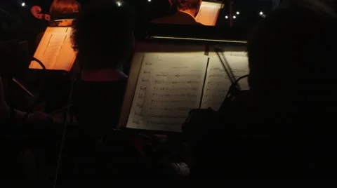 The String Section of An Orchestra Is Sitting During a Break Before Performing Video stock 60228187
