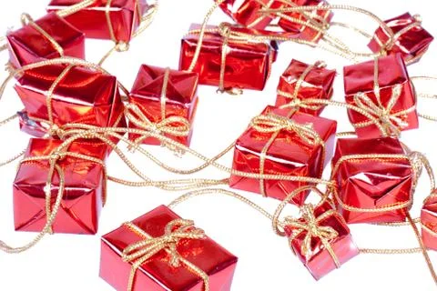 String of small decorative Christmas presents at a golden rope Stock Photos