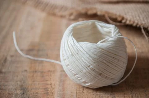 String spool on wooden background 스톡 사진