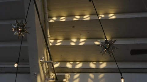 Stringed star shaped lanterns over head Stock Footage 255167388