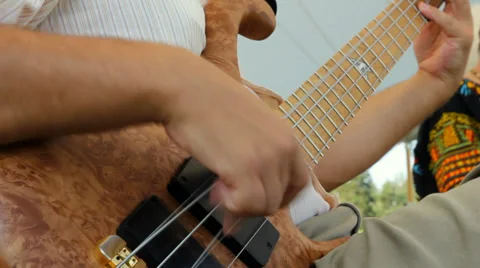 Stringing bass guitar, close up Stock Footage 34855579