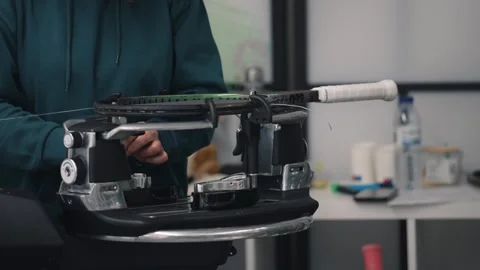Stringing a tennis racket on machine Stock Footage 266770107