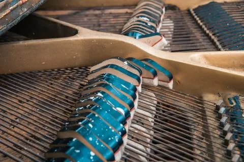 Strings and hammers inside the old piano Stock Photos