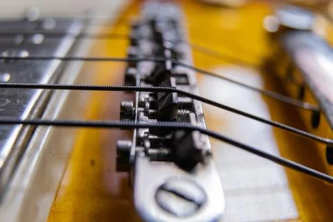 Strings and pickups of classic yellow electric guitar Stock Photos