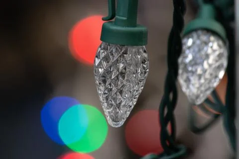 Strings of christmas lights hanging down ready to decorate a home Stock Photos