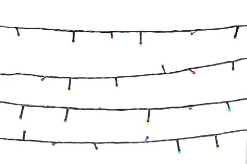 Strings of Christmas lights on white background Stock Photos
