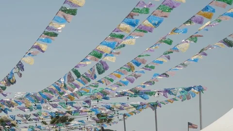Strings of Colorful Flags Blowing in Wind Slow Motion, 4k Stock Footage 124904874