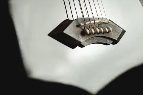 Strings of harmony resonate softly in a cozy indoor space Stock Photos