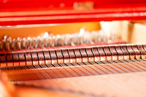 Strings, mallets, dampeners and sound board inside grand piano Stock Photos