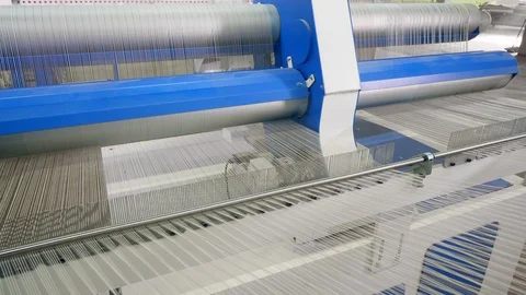 Strings move on a machine, spooling at a textile plant. Stock Footage 105739530