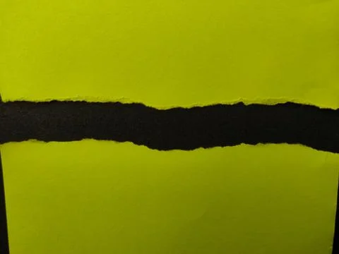 A strip of black textured surface is visible between two jagged edges of br.. Stock Photos