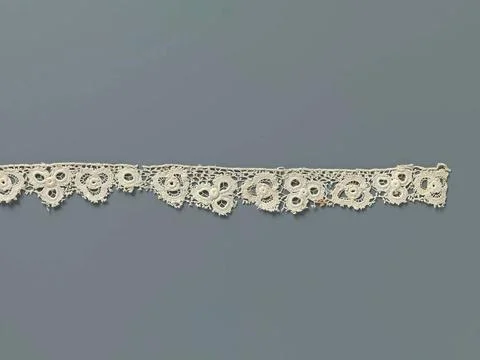 Strip crochet side with triangular floral pattern made with open circles. ... Stock Photos