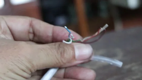 Strip the skin of a network cable. Stock Footage 287525730